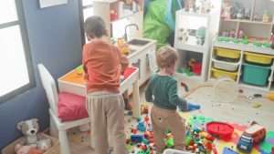Boy,Playing,With,Blocks,And,A,Toy,Truck,Amid,Scattered