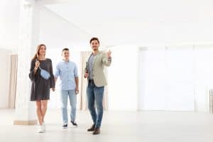Real,Estate,Agent,Showing,New,Apartment,To,Young,Couple.,Space