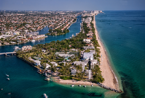 Aerial,View,Of,Lighthouse,And,Boating,Inlet,From,Atlantic,Ocean